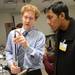University of Michigan resident Dr. Benjamin Bryner M.D. shows Cass Tech freshman Abdul Rashid, 14,  a tool used for laproscopic surgery simulator during a tour o f the Clinical Simulation Center at University of Michigan Hospital on Thursday, Jan. 10. Melanie Maxwell I AnnArbor.com